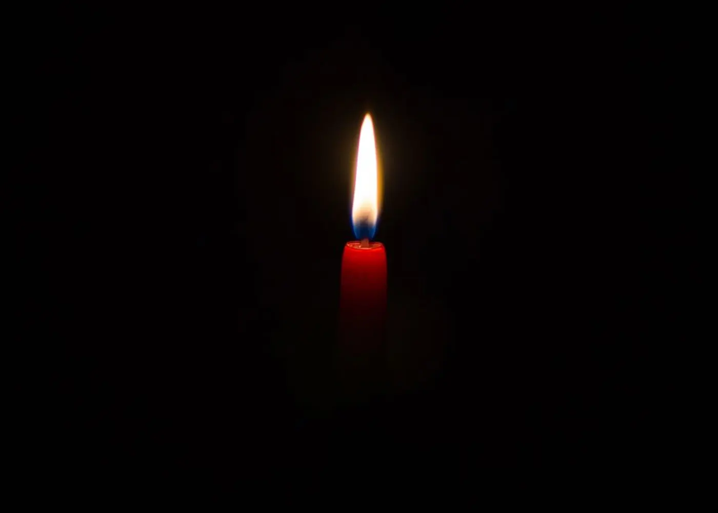A single candle in a quiet room.